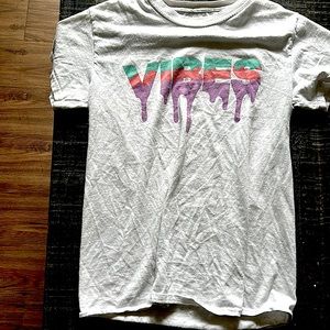 selling a t-shirt in the size small it is white with letters that say vibes